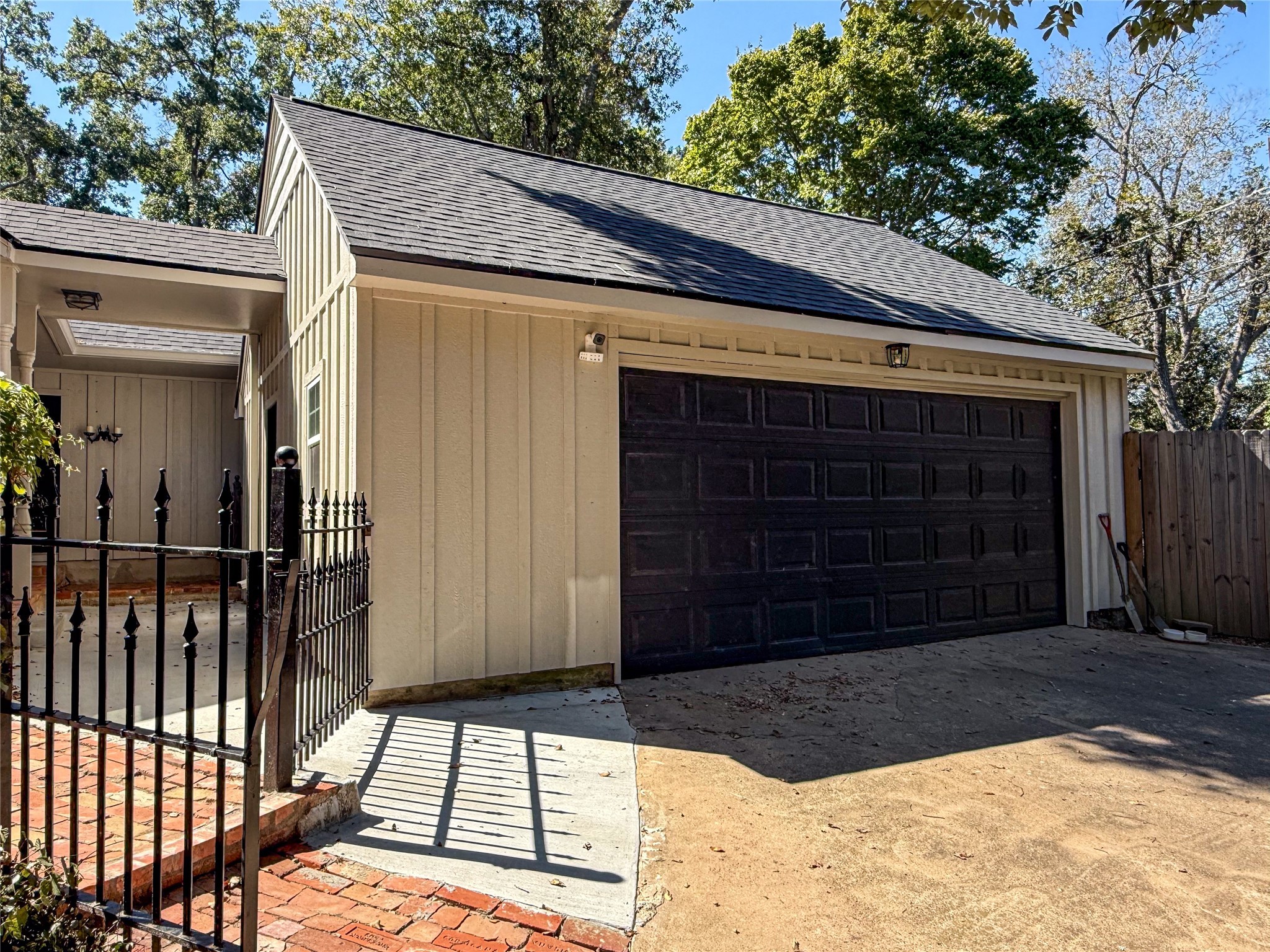 1704 Harrison Road Brenham, TX 77833 - Photo 30 of 34 a view of a house with a door and wooden walls