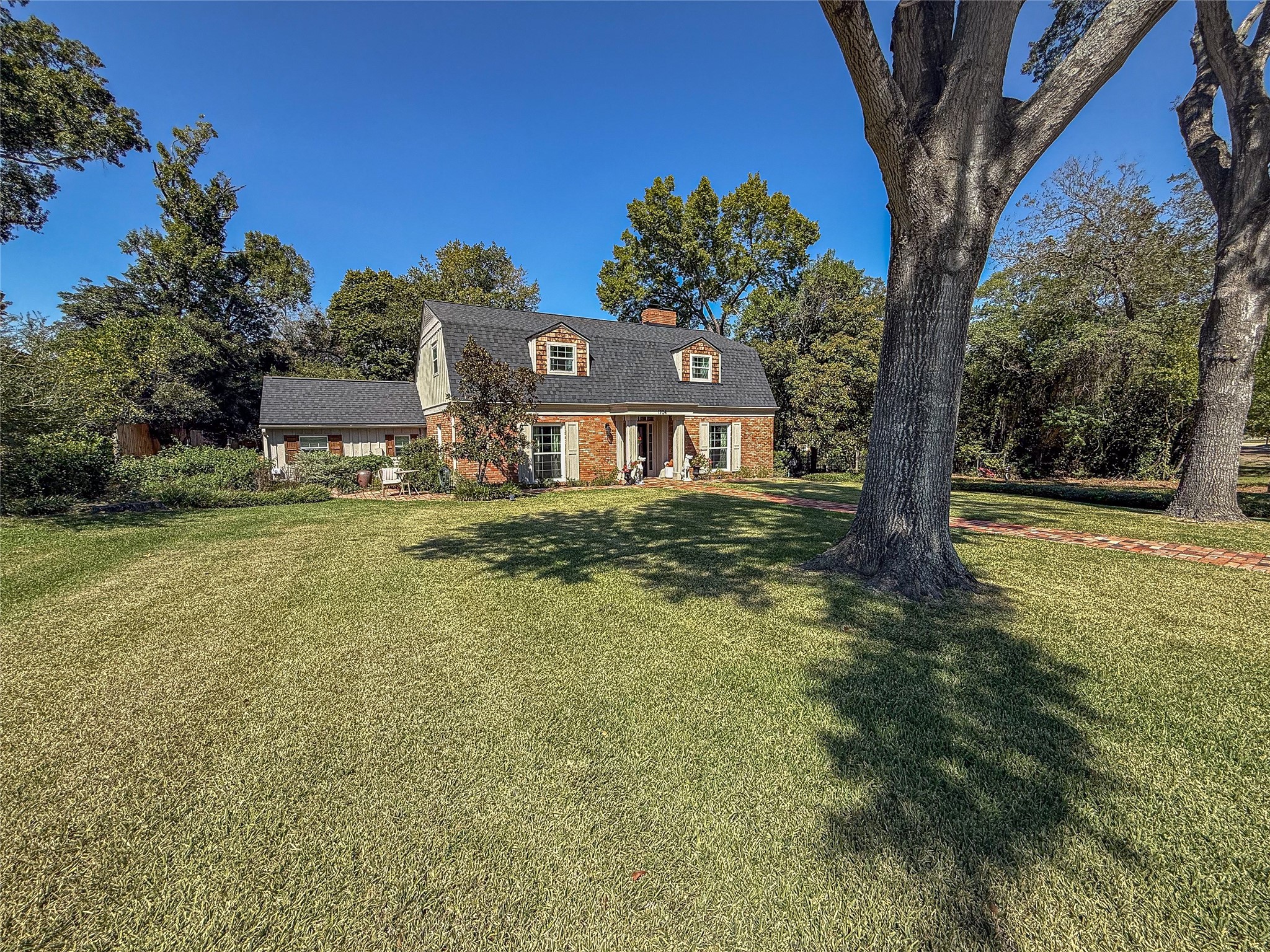 1704 Harrison Road Brenham, TX 77833 - Photo 34 of 34 a front view of a house with a yard