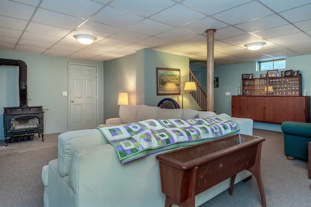 a bed room with a bed and a television