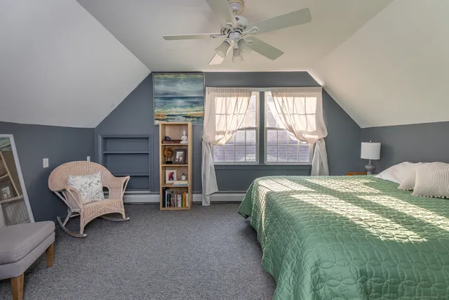 a bed room with a bed and a window