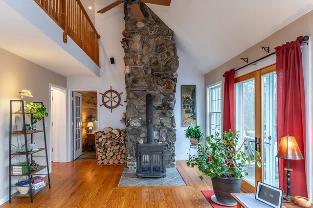 a view of front door with potted plants