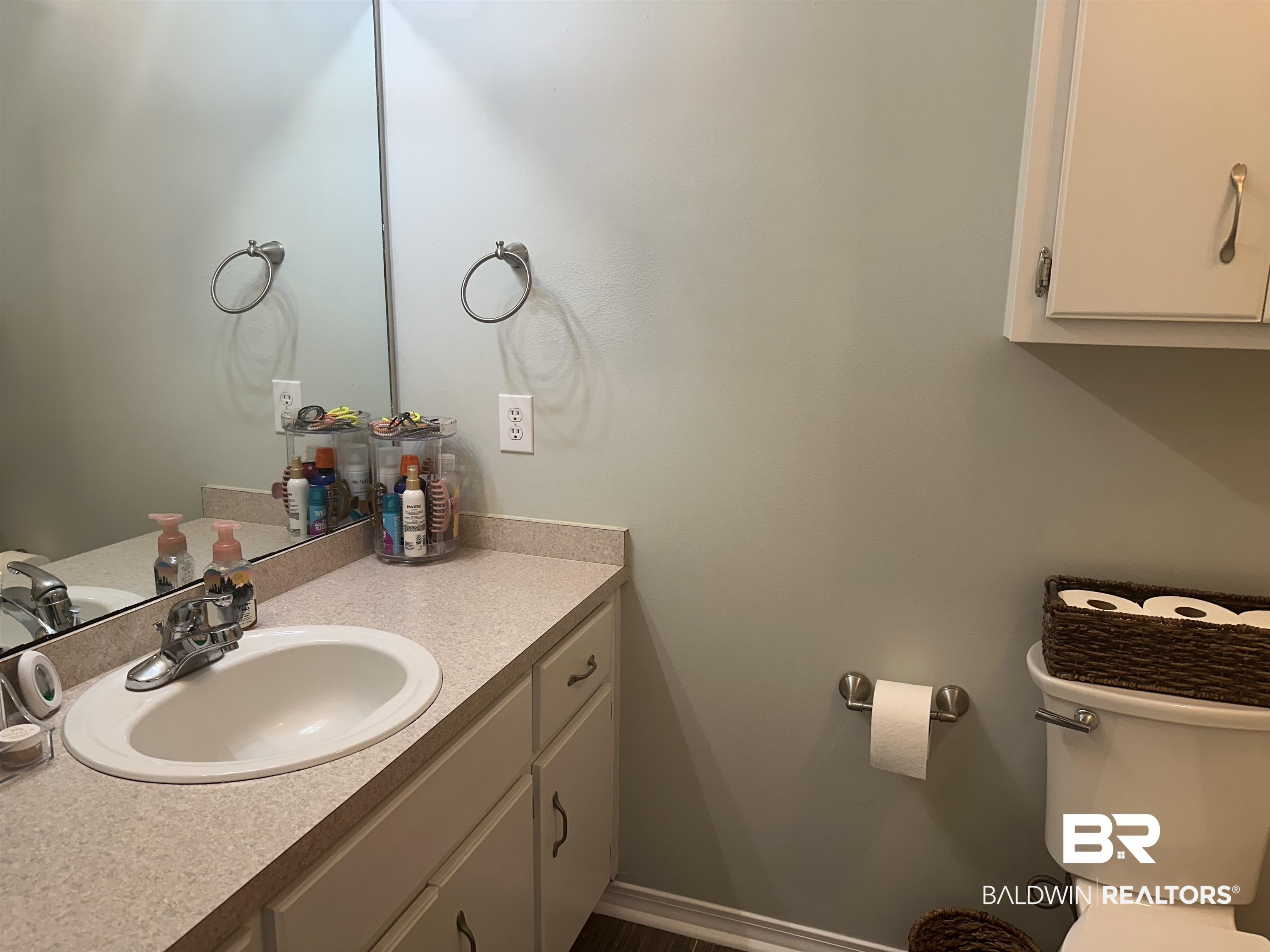 4882 Rebecca Place Mobile, AL 36695 - Photo 13 of 29 Bathroom with vanity, toilet, and baseboards