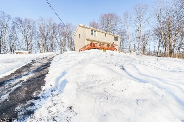 a view of a backyard with a snow