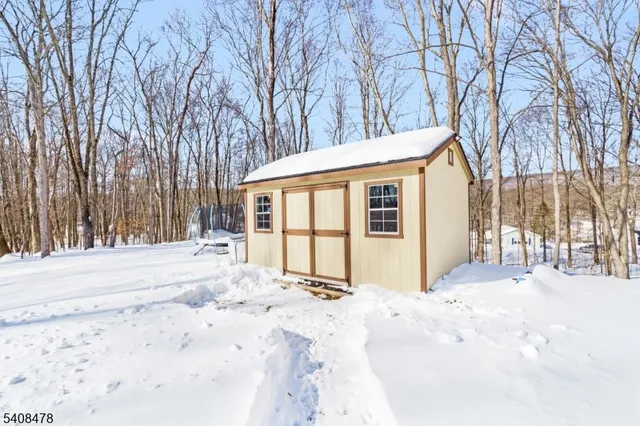 a view of back yard covered with snow
