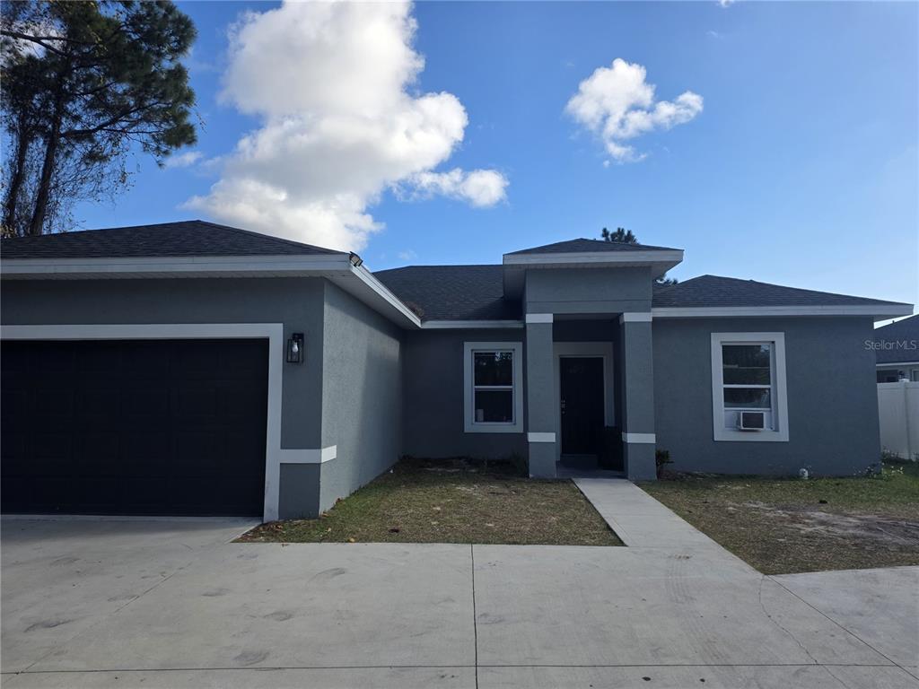 697 James Court Kissimmee, FL 34759 - Photo 1 of 17 a view of a house with a yard
