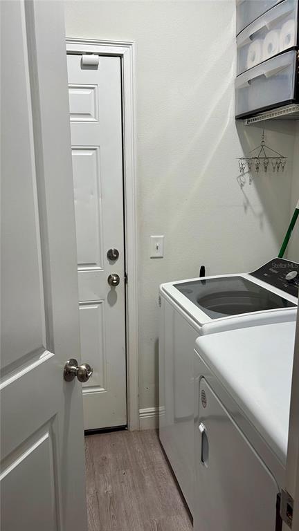 697 James Court Kissimmee, FL 34759 - Photo 16 of 17 a utility room with dryer and washer