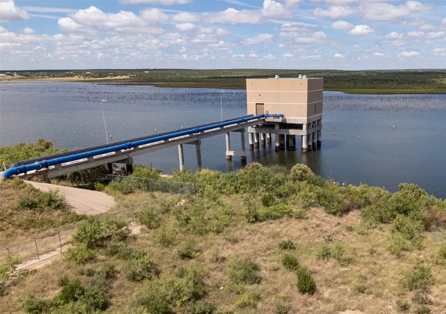 a view of swimming pool with outdoor seating