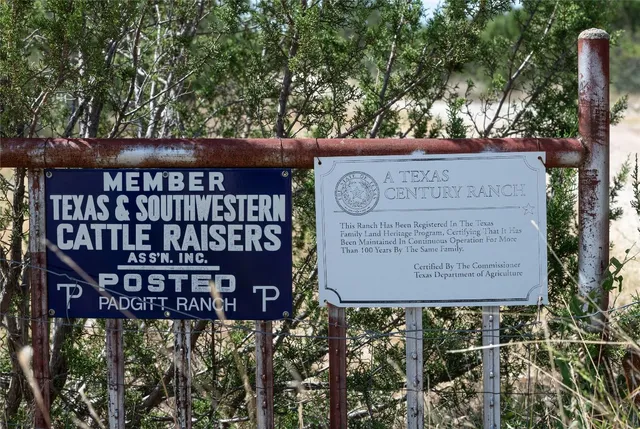 a view of outdoor space with signage and flags