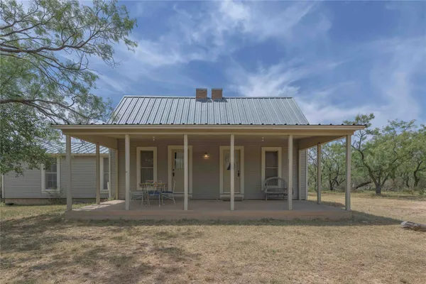 front view of a house with a garden