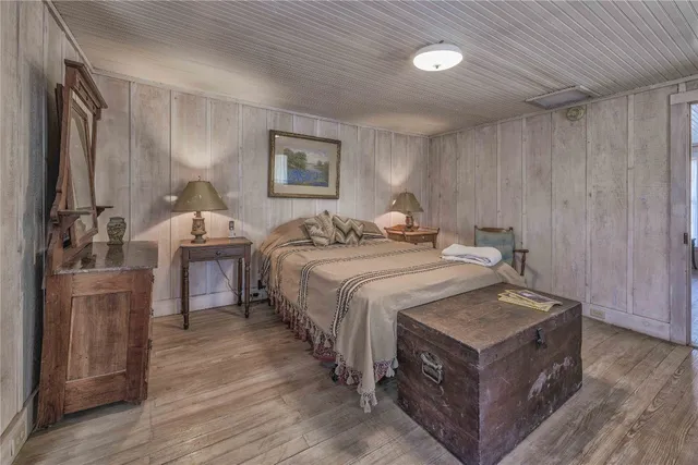 a bedroom with a bed and a dresser