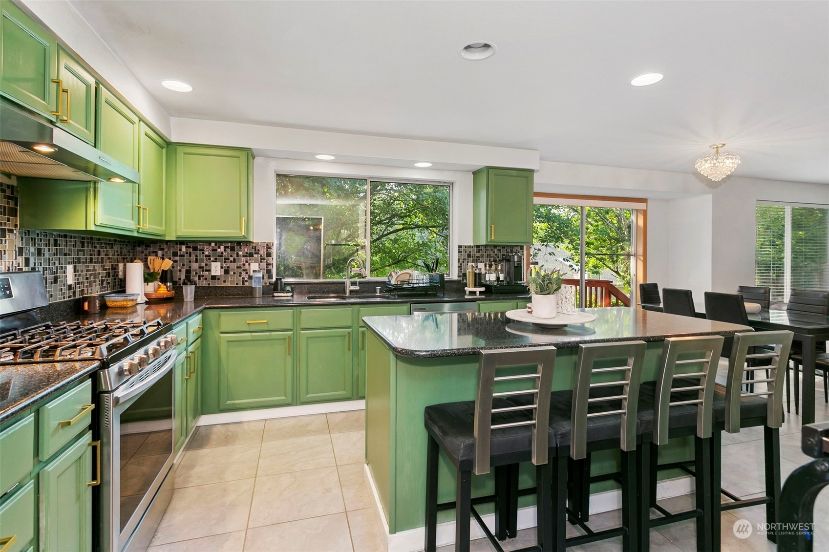 32335 7th Avenue Southwest Federal Way, WA 98023 - Photo 11 of 27 a kitchen with stainless steel appliances granite countertop a stove a sink and a refrigerator