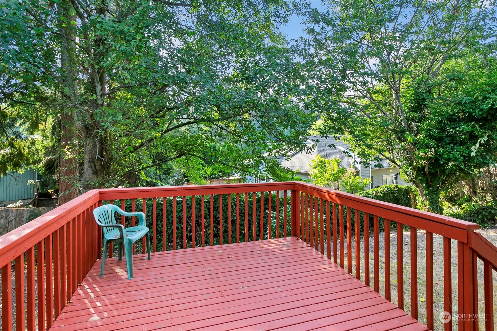 32335 7th Avenue Southwest Federal Way, WA 98023 - Photo 13 of 27 a balcony with wooden floor and trees in the back