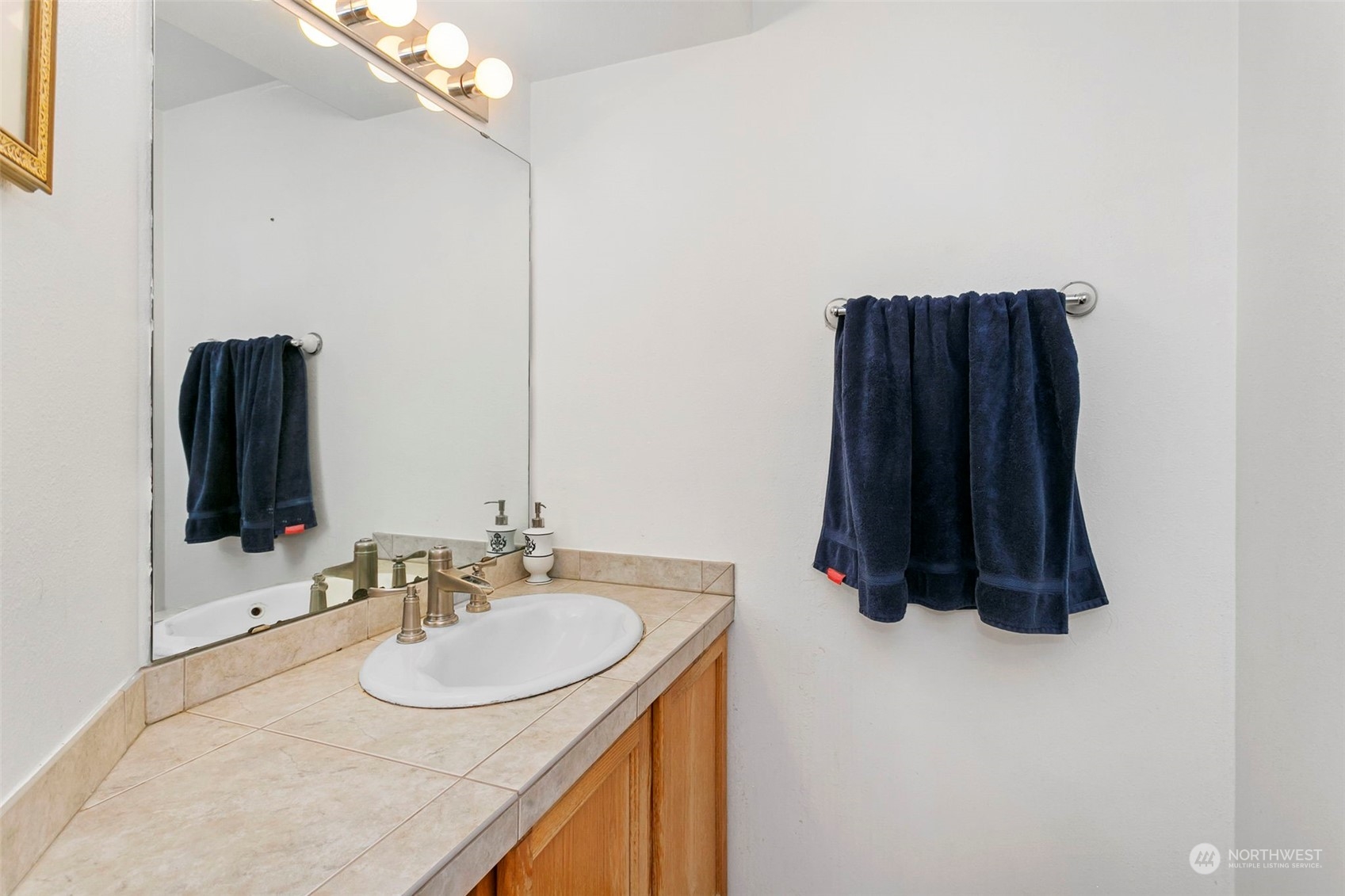 32335 7th Avenue Southwest Federal Way, WA 98023 - Photo 16 of 27 a bathroom with a sink and a mirror