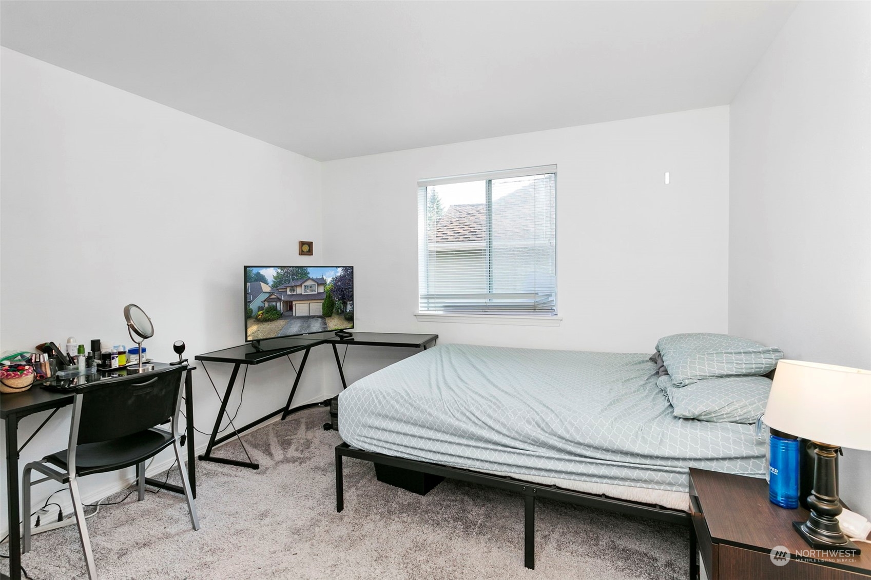 32335 7th Avenue Southwest Federal Way, WA 98023 - Photo 20 of 27 a bedroom with a bed and a table in it
