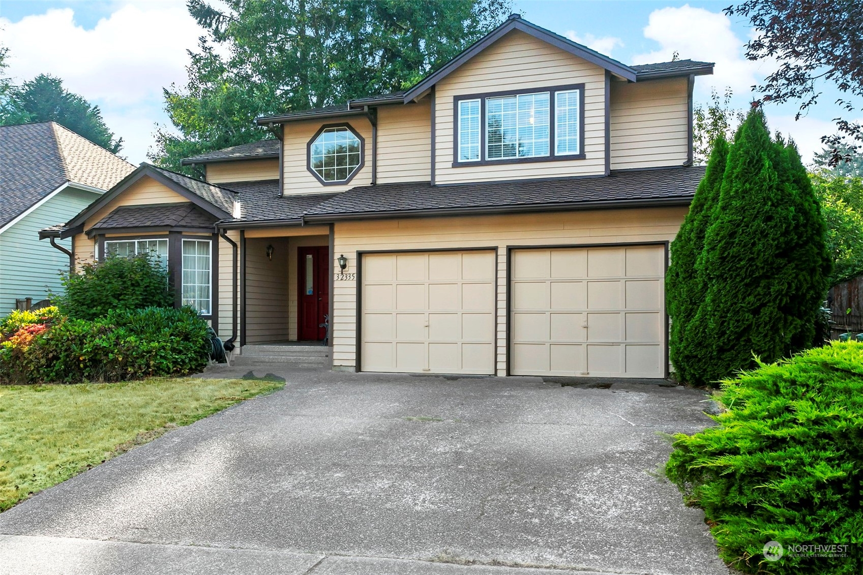 32335 7th Avenue Southwest Federal Way, WA 98023 - Photo 2 of 27 a front view of a house with garden