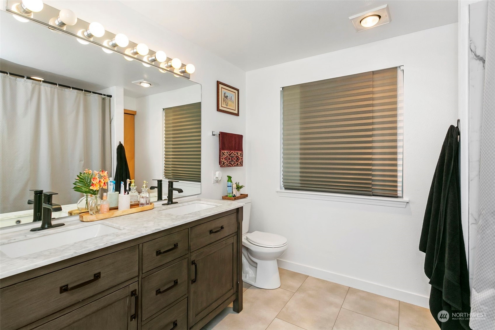 32335 7th Avenue Southwest Federal Way, WA 98023 - Photo 21 of 27 a bathroom with a double vanity sink a mirror and a bathtub