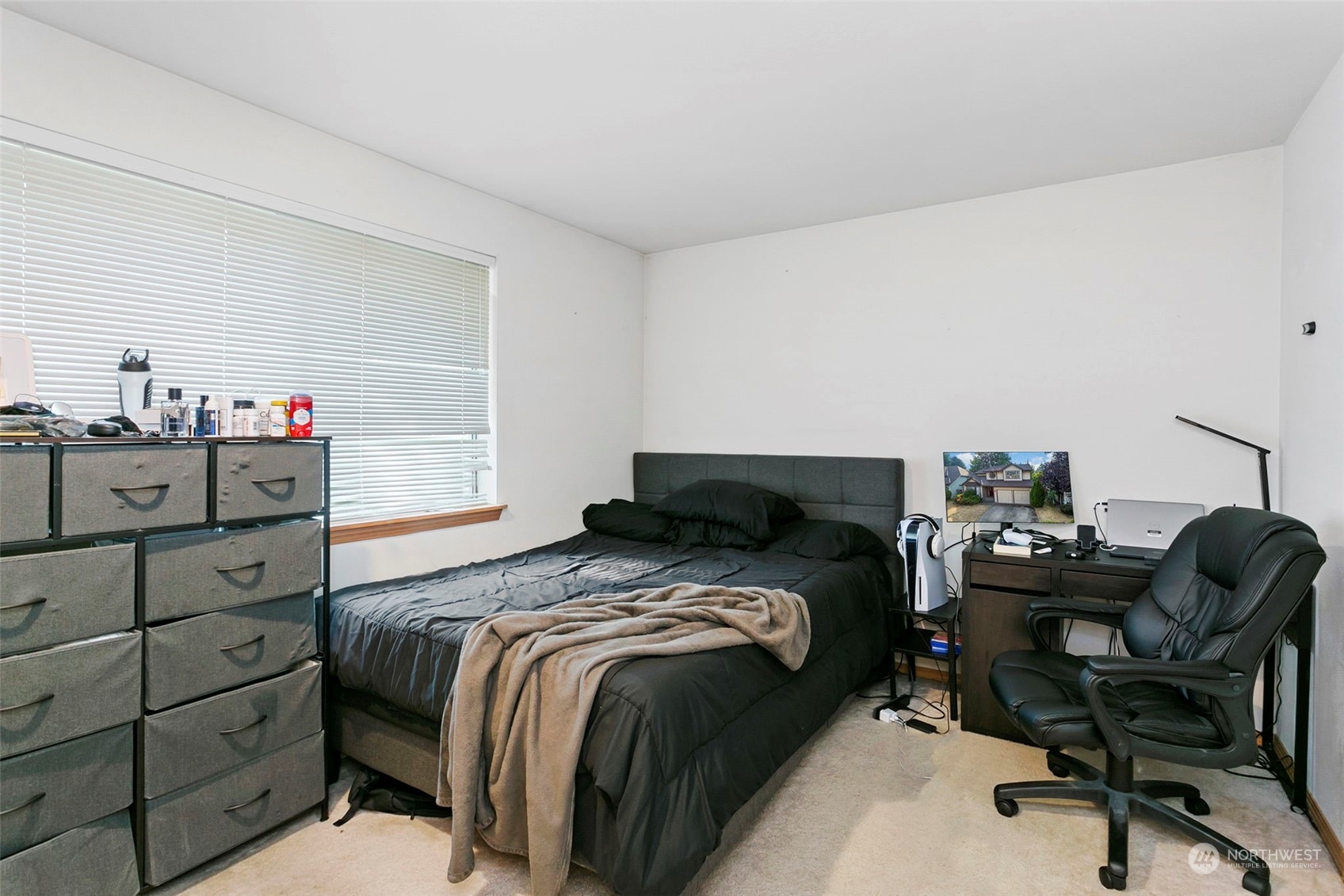 32335 7th Avenue Southwest Federal Way, WA 98023 - Photo 23 of 27 a bed sitting in a bedroom next to a window