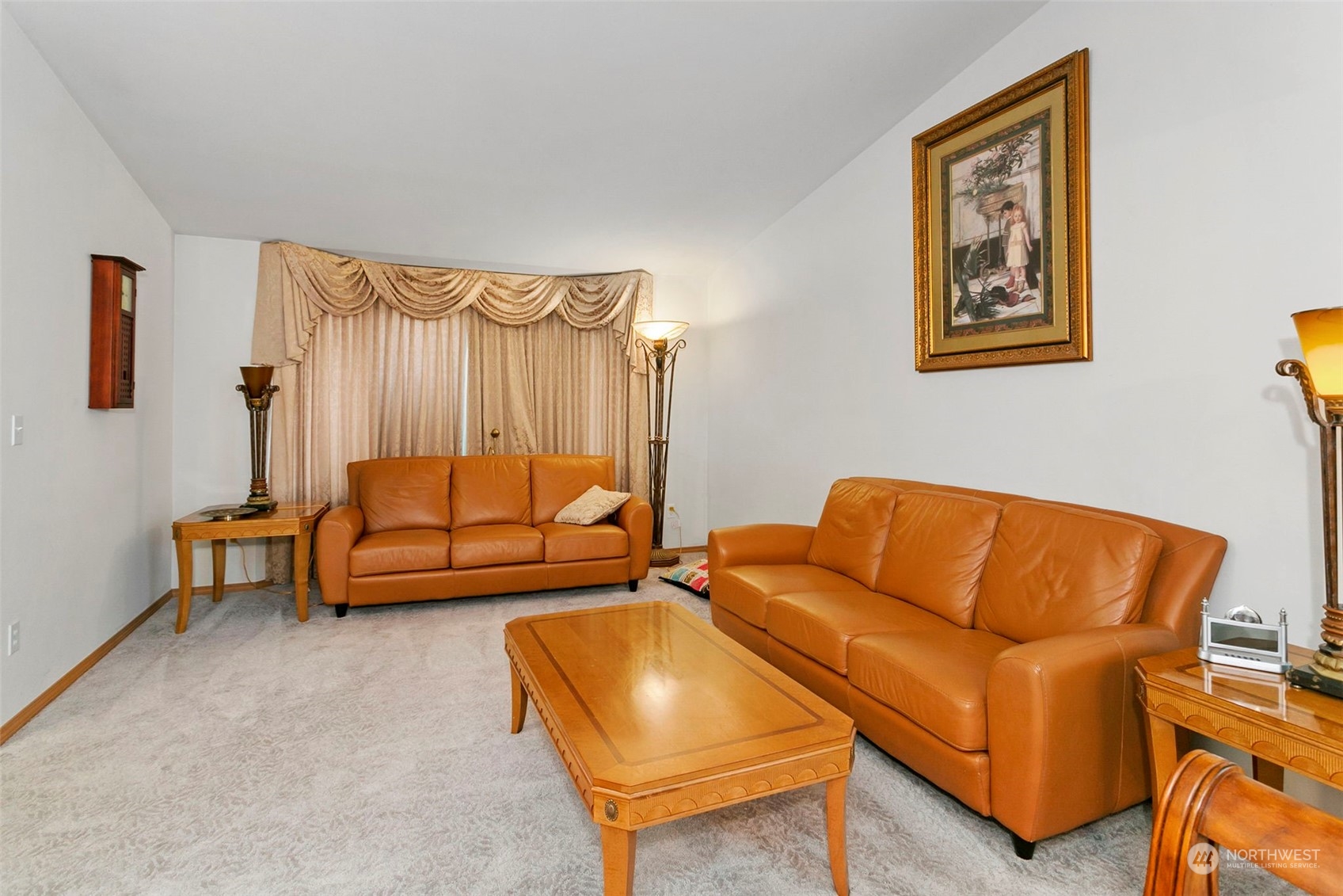 32335 7th Avenue Southwest Federal Way, WA 98023 - Photo 6 of 27 a blue couch sitting in a living room next to a couch