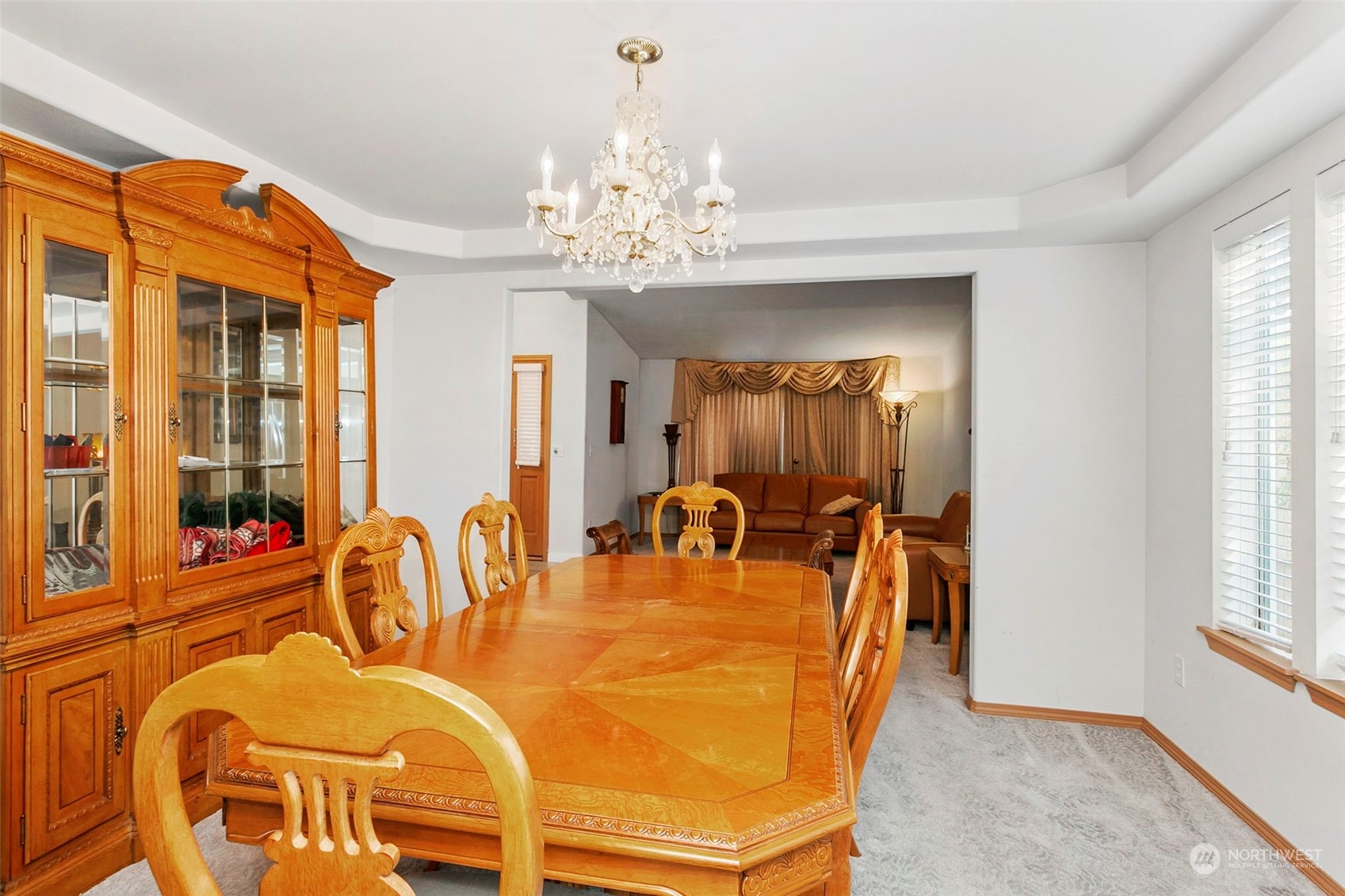 32335 7th Avenue Southwest Federal Way, WA 98023 - Photo 9 of 27 a dining room with furniture a chandelier and a rug