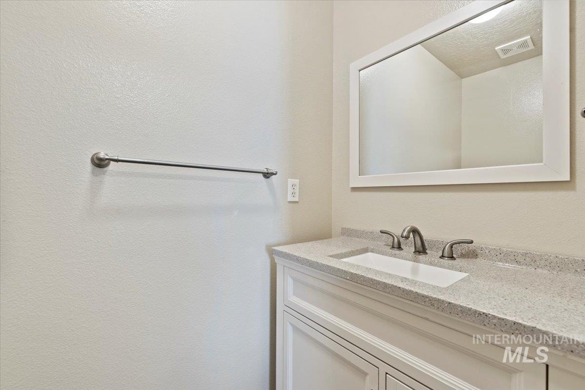 994 North Gray Cloud Way Meridian, ID 83642 - Photo 22 of 28 Bathroom featuring vanity and a textured wall