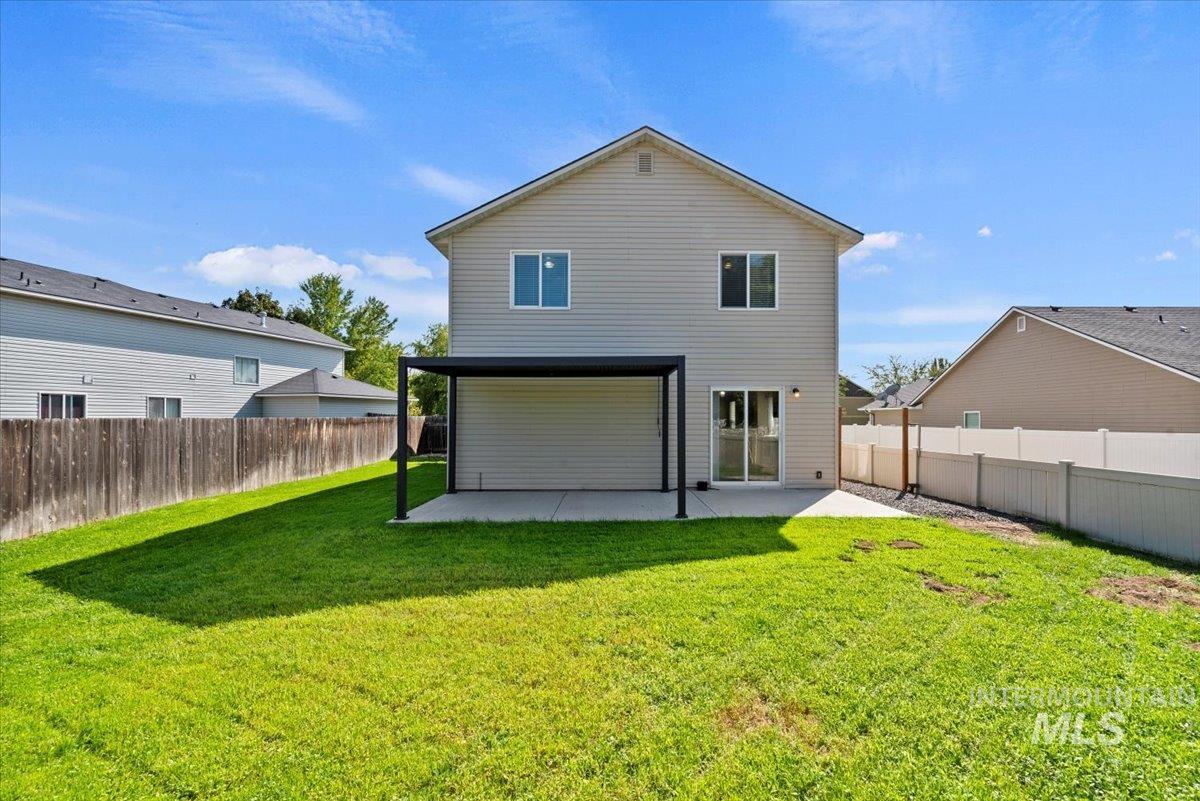 994 North Gray Cloud Way Meridian, ID 83642 - Photo 26 of 28 Rear view of property with a patio and a fenced backyard