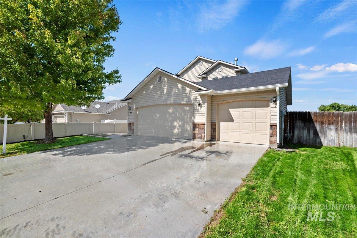 994 North Gray Cloud Way Meridian, ID 83642 - Photo 3 of 28 View of front of home with concrete driveway and an attached garage