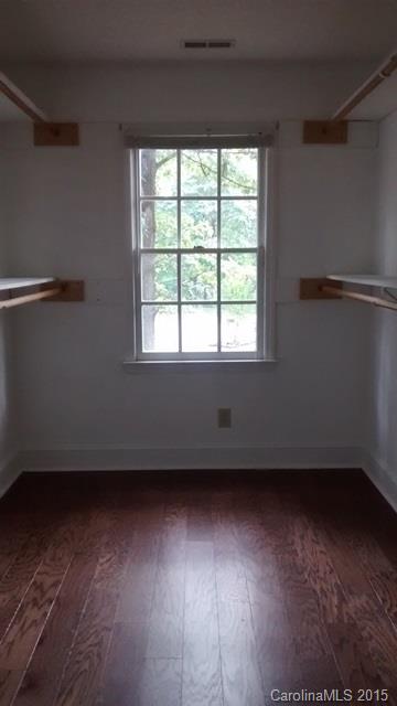 2464 Winding Trail Lane Fort Mill, SC 29708 - Photo 11 of 22 an empty room with wooden floor and windows