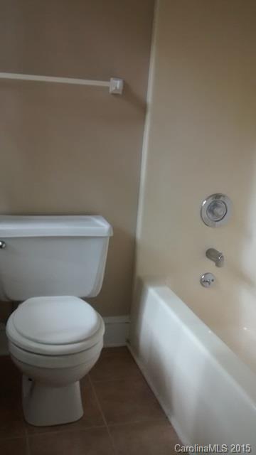 2464 Winding Trail Lane Fort Mill, SC 29708 - Photo 18 of 22 a white toilet sitting next to a bath tub