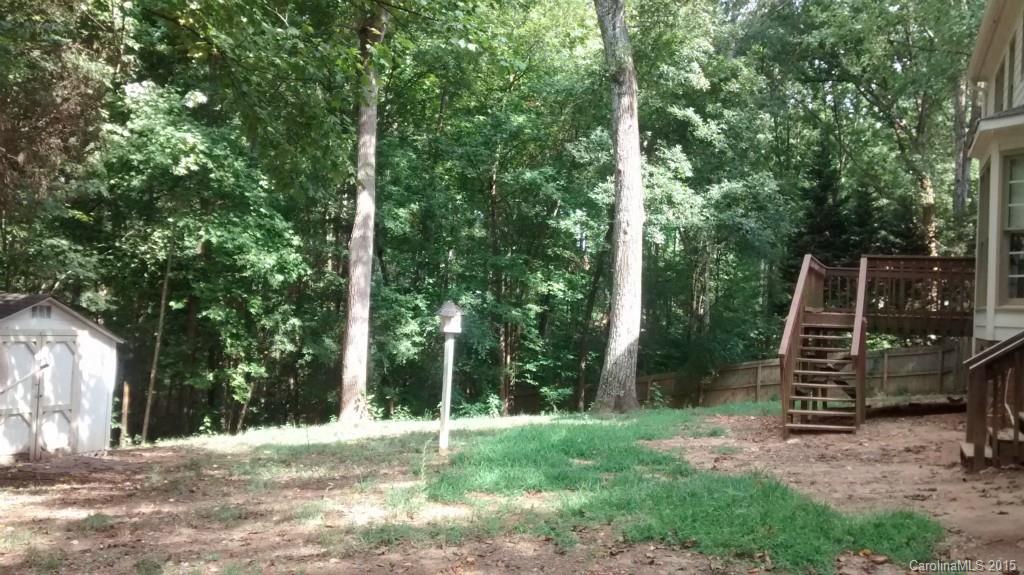 2464 Winding Trail Lane Fort Mill, SC 29708 - Photo 22 of 22 a view of a wooden deck with a trees