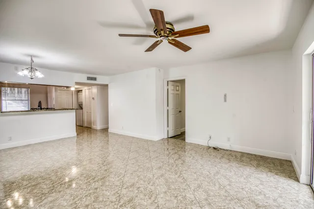 a view of a kitchen with a sink and cabinets