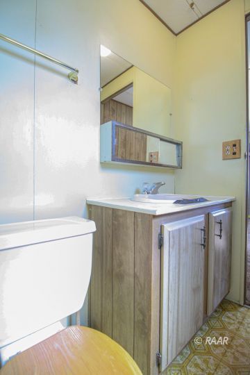1313 North Leroy Street Ridgecrest, CA 93555 - Photo 24 of 27 a bathroom with a sink a toilet and shower