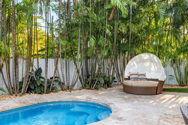 a view of a swimming pool with sitting area