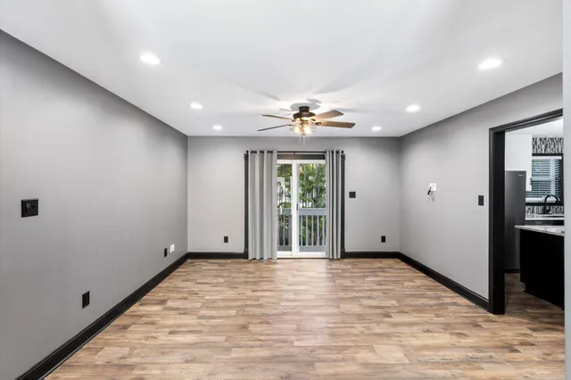 a view of livingroom with hardwood floor and ceiling fan
