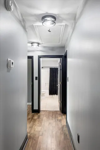 a bathroom with a sink a toilet a mirror and shower