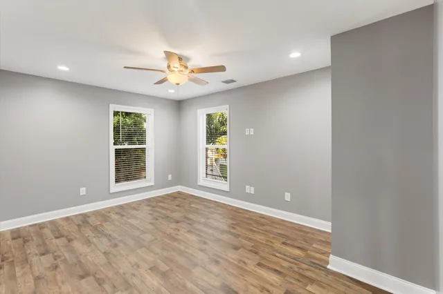 a spacious bathroom with a sink and a mirror