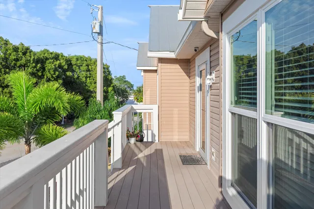 a view of a balcony with wooden floor