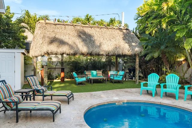 a view of a swimming pool with sitting area
