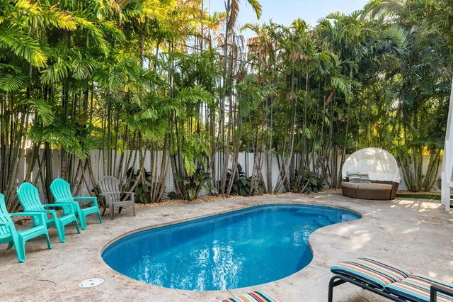 a view of a chairs and table in the patio
