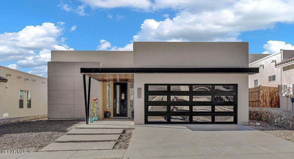 a front view of a house with garage