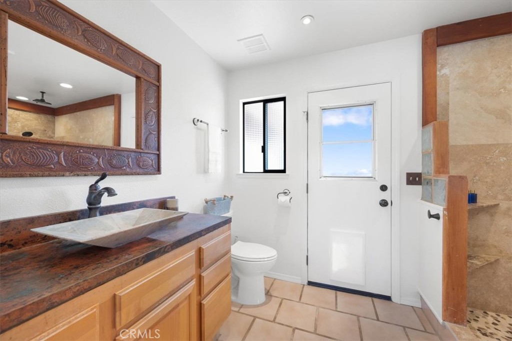 9750 Random Canyon Way Creston, CA 93432 - Photo 28 of 73 a bathroom with a sink a toilet and shower