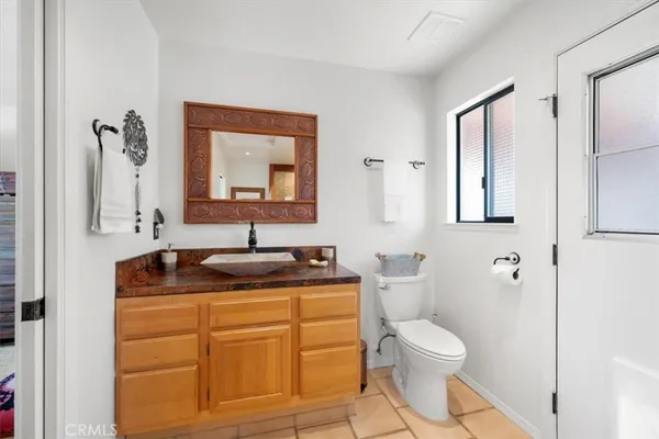 a bedroom with a bed and chair