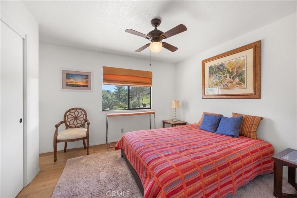 9750 Random Canyon Way Creston, CA 93432 - Photo 38 of 73 a bedroom with a bed and chair