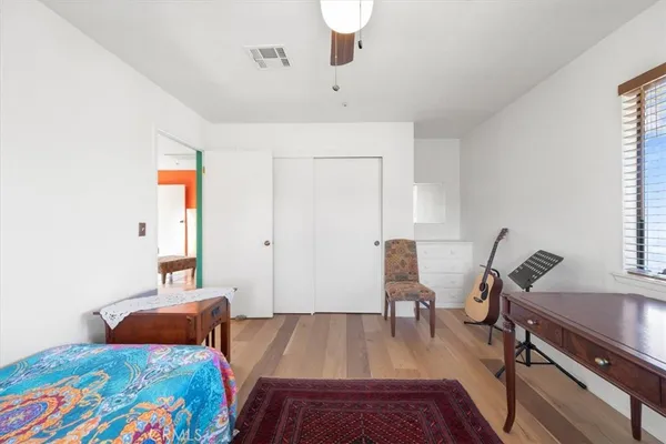 a view of a backyard with wooden fence