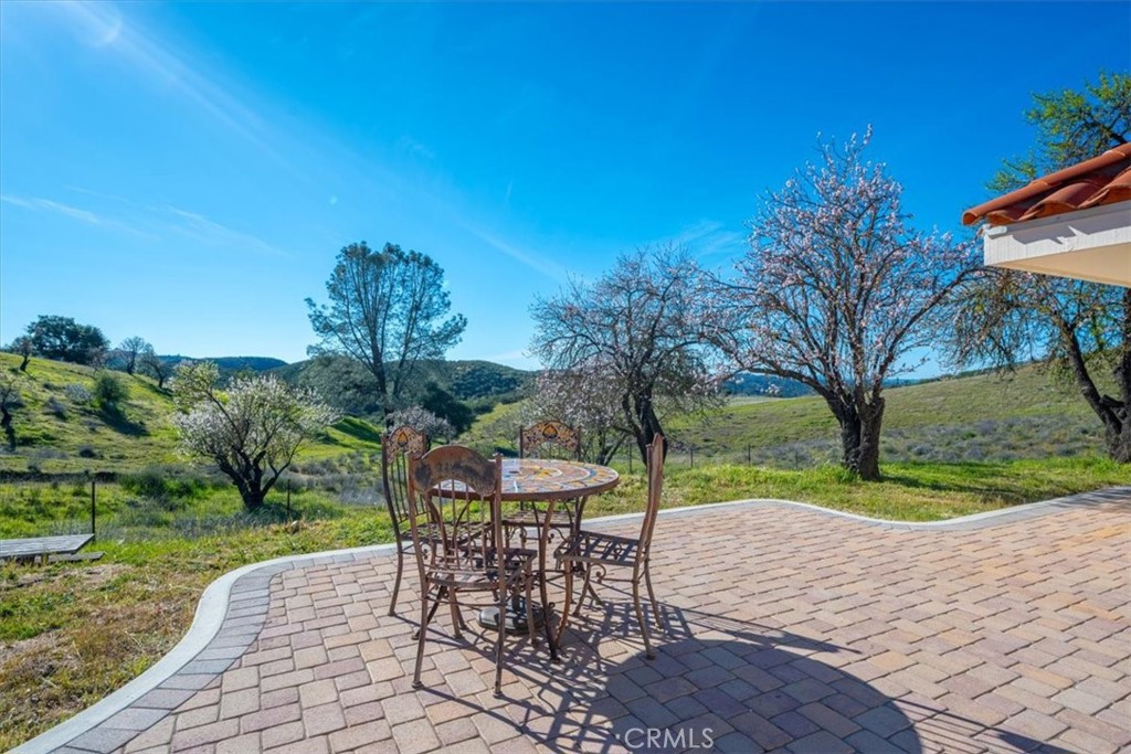 9750 Random Canyon Way Creston, CA 93432 - Photo 61 of 73 a view of a table and chairs in patio with a yard