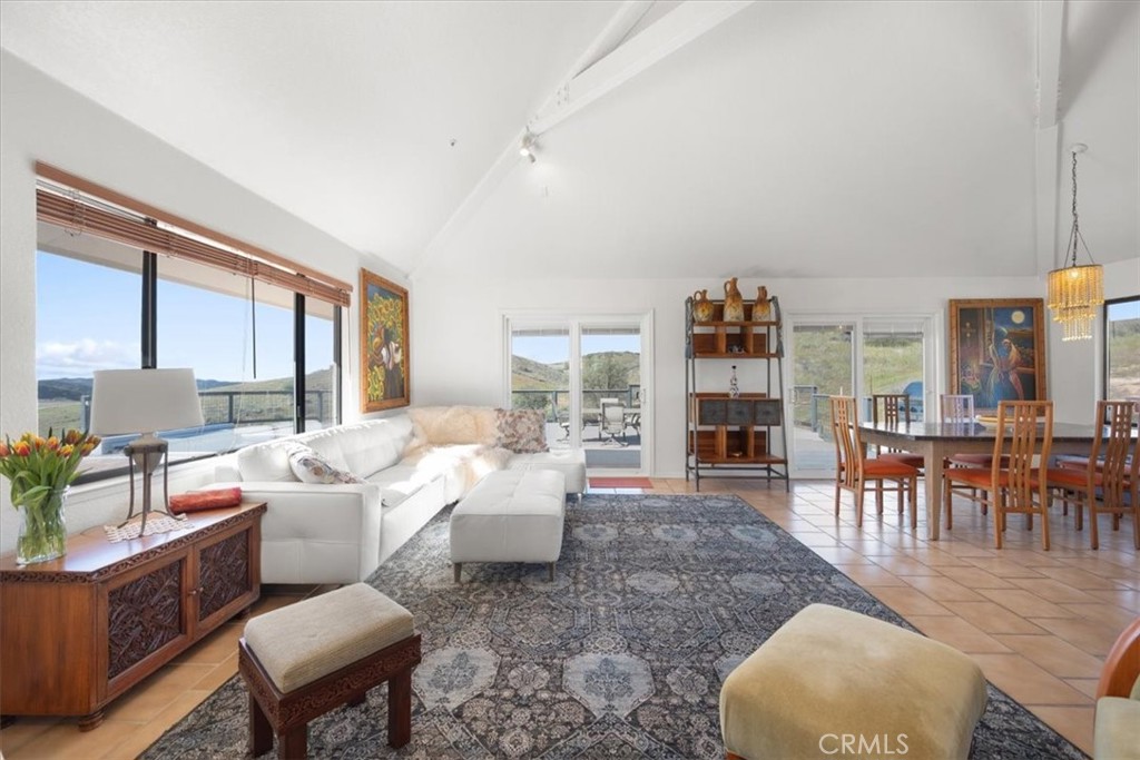 9750 Random Canyon Way Creston, CA 93432 - Photo 10 of 73 a living room with fireplace furniture and a large window