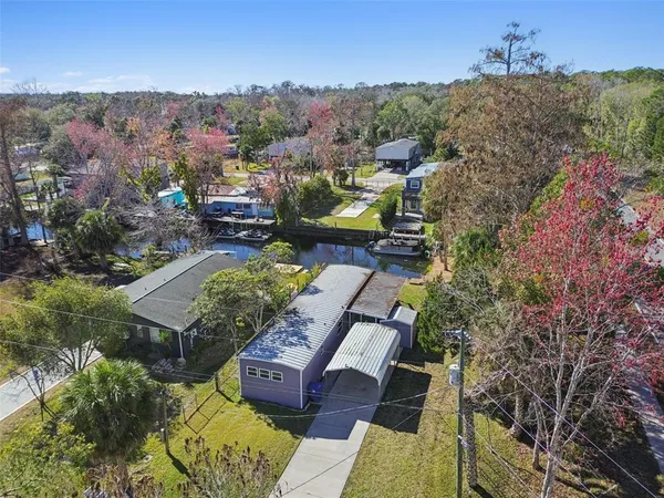an aerial view of house with yard