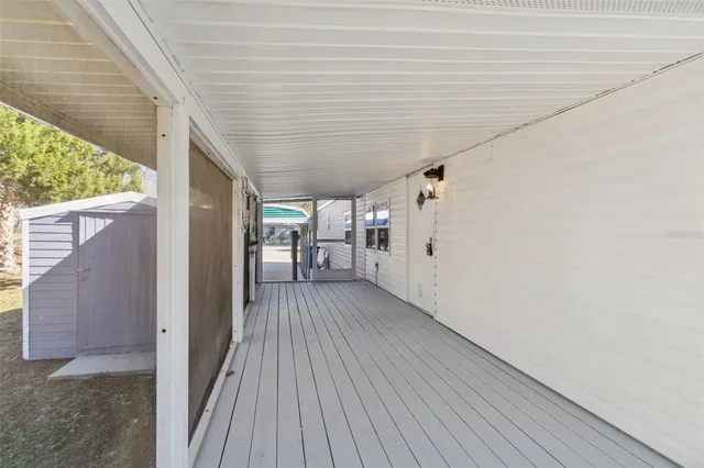 a large kitchen with a lot of counter space and wooden floor