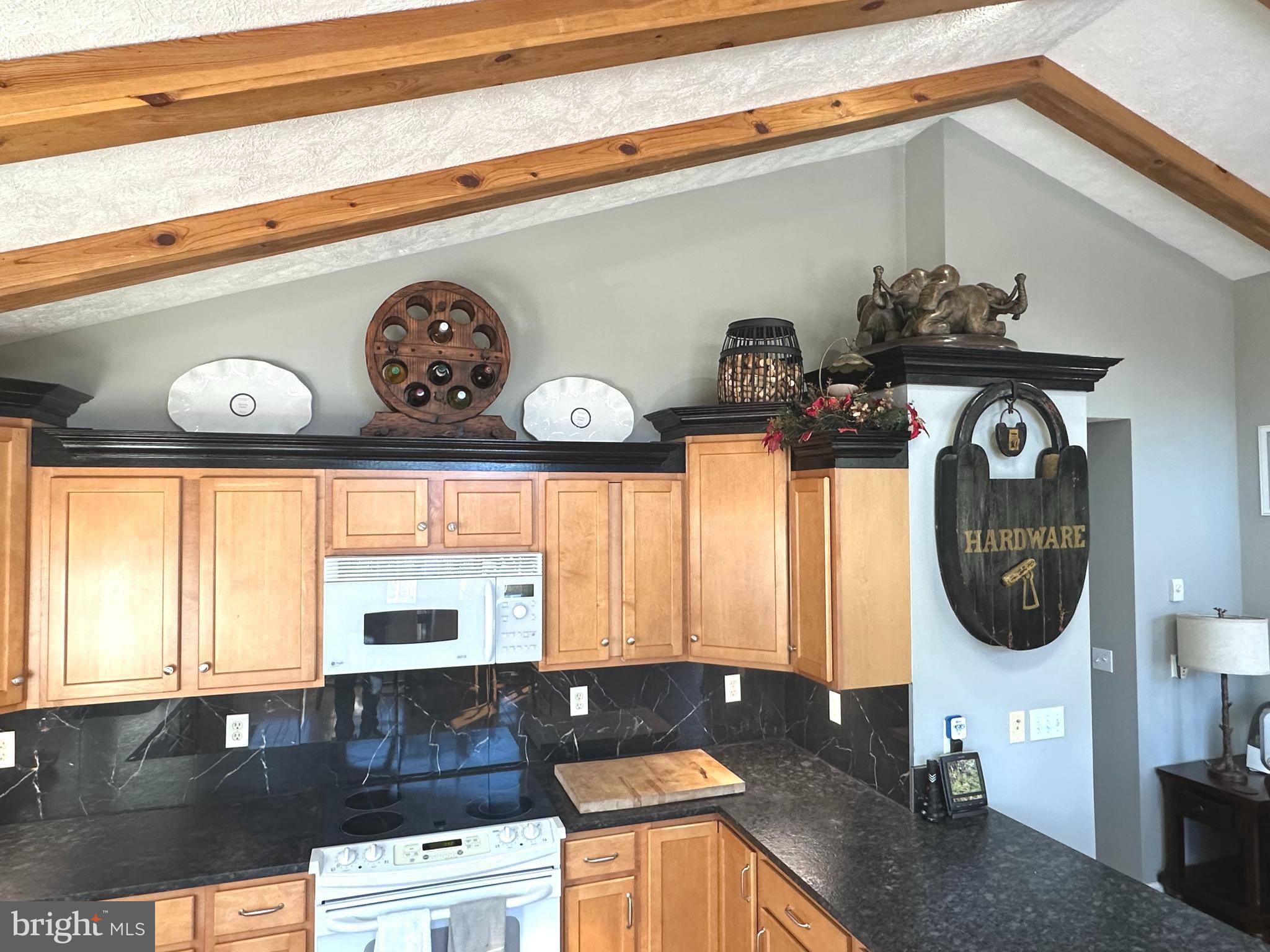 400 Locust Ridge Moorefield, WV 26836 - Photo 21 of 87 a kitchen with a stove a microwave and cabinets