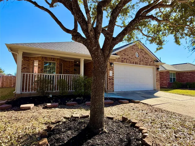 a view of a house with a yard covered with snow in the background