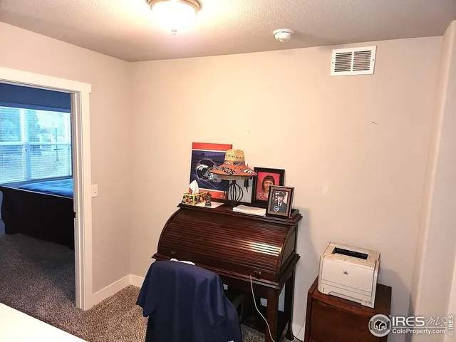 a view of a workspace with furniture